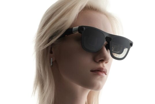 XREAL Aura Android XR glasses worn by a model, official press image