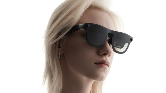 XREAL Aura Android XR glasses worn by a model, official press image