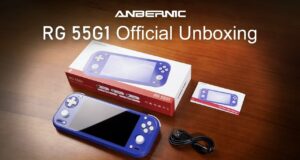 Indigo Anbernic RG 55G1 on a wood table with retail box, user manual, and USB cable