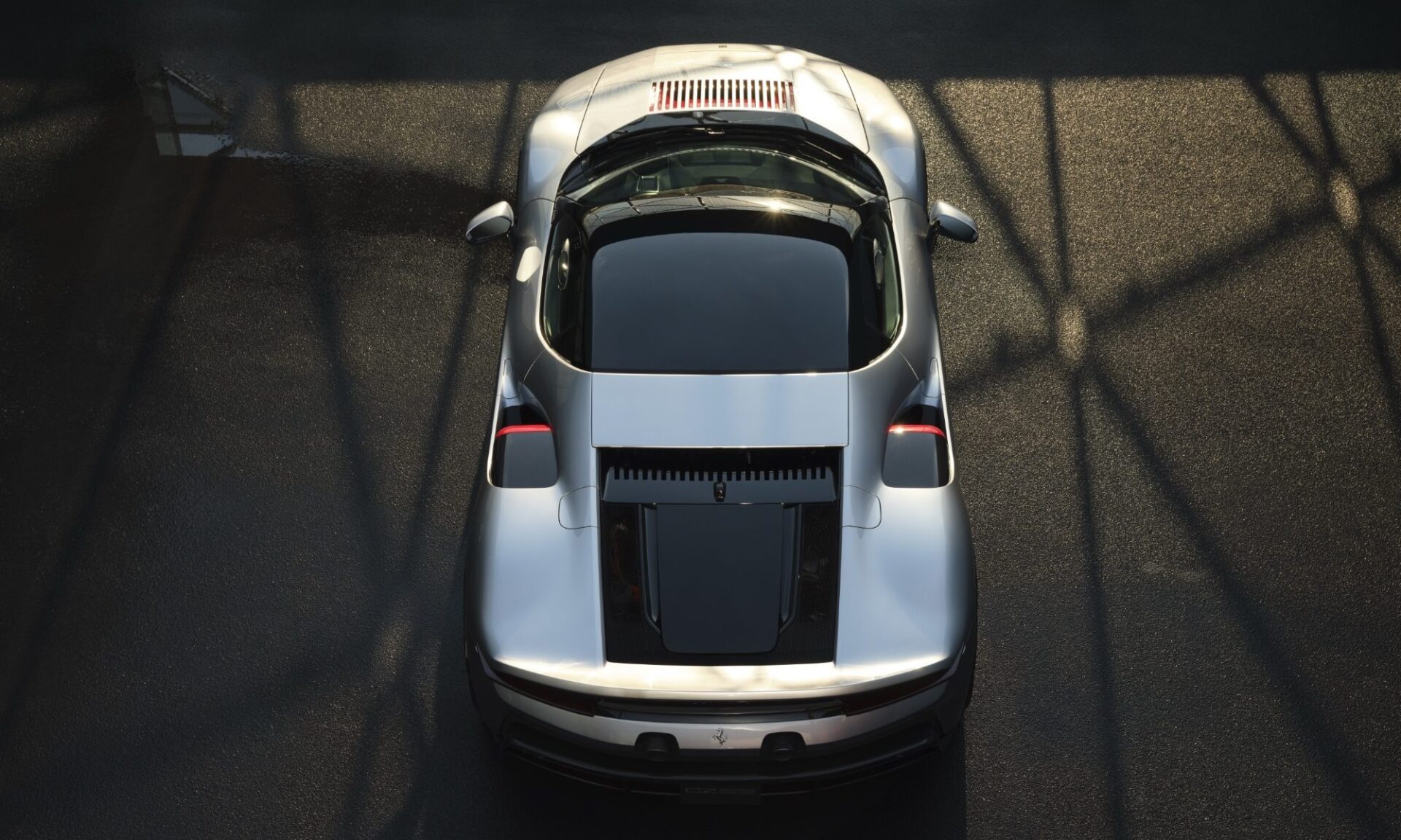 Official overhead of the Ferrari CZ26 showing the engine cover, spoiler, and truncated tail