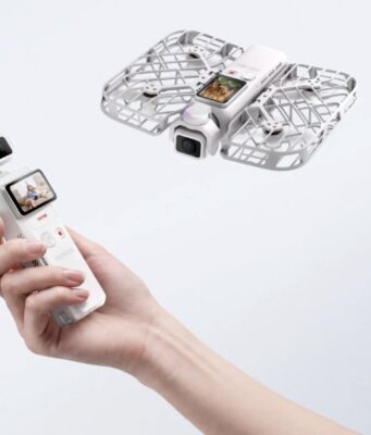 HOVERAir VERSA Is a Pocket Gimbal Camera That Flies Hand holding HOVERAir VERSA pocket gimbal with flying cage-protected camera unit
