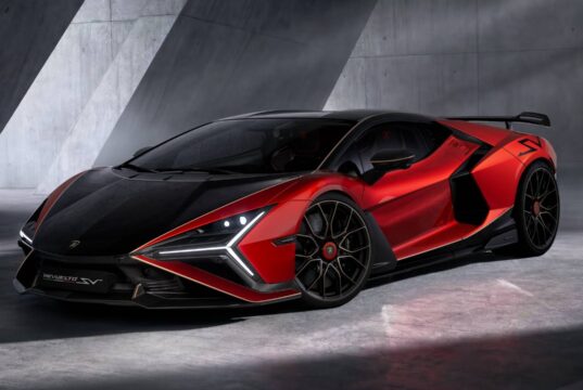 Official three-quarter studio shot of the red and black Lamborghini Revuelto SV