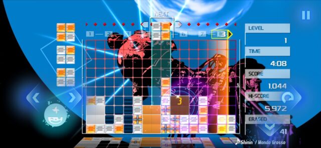 lumines-remastered-mobile-gameplay Official Lumines Remastered mobile screenshot of orange and white blocks on a blue stage