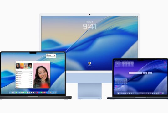 Official macOS Tahoe hero on a MacBook