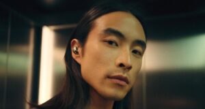 Sennheiser Momentum True Wireless 5: Specs and Price Person wearing Sennheiser Momentum True Wireless 5 earbuds in white