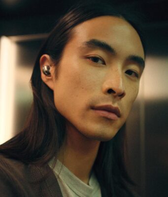 Sennheiser Momentum True Wireless 5: Specs and Price Person wearing Sennheiser Momentum True Wireless 5 earbuds in white