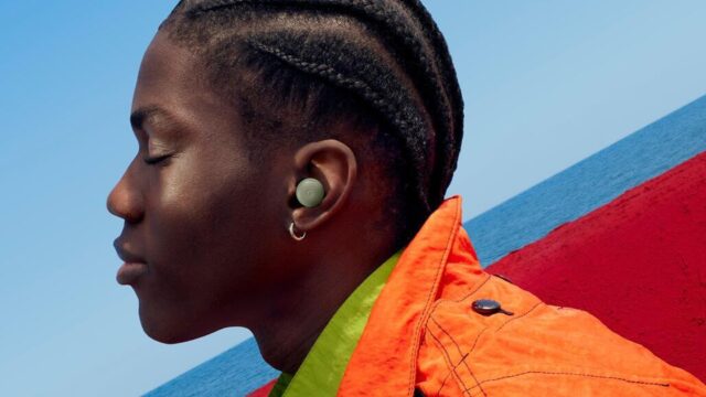 Pixel Buds Pro 2 in the new Olive finish worn outdoors