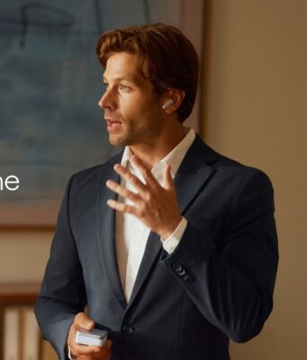 Plaud One earbuds: $249.99 wearable that records without a phone Plaud One earbud worn by a speaker during a meeting