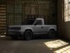 Slate Truck skips built-in infotainment for your phone Gray Slate Truck parked in a warehouse with sunlight on the floor