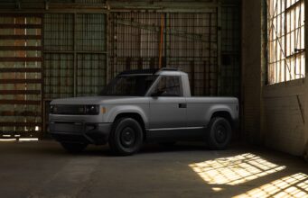 Slate Truck skips built-in infotainment for your phone Gray Slate Truck parked in a warehouse with sunlight on the floor