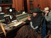Suno Audio Watermarks Will Flag AI Songs for Platforms Suno audio watermarks announcement: musicians collaborating in a studio using Suno