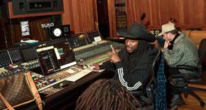 Suno Audio Watermarks Will Flag AI Songs for Platforms Suno audio watermarks announcement: musicians collaborating in a studio using Suno
