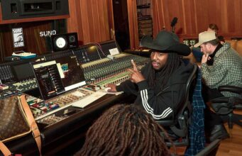 Suno Audio Watermarks Will Flag AI Songs for Platforms Suno audio watermarks announcement: musicians collaborating in a studio using Suno