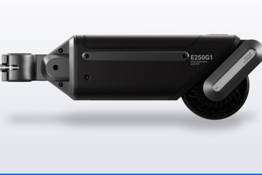 ASUS Oxiis E250G1 Intelligent Bike Booster shown in profile with its seatpost clamp and drive roller
