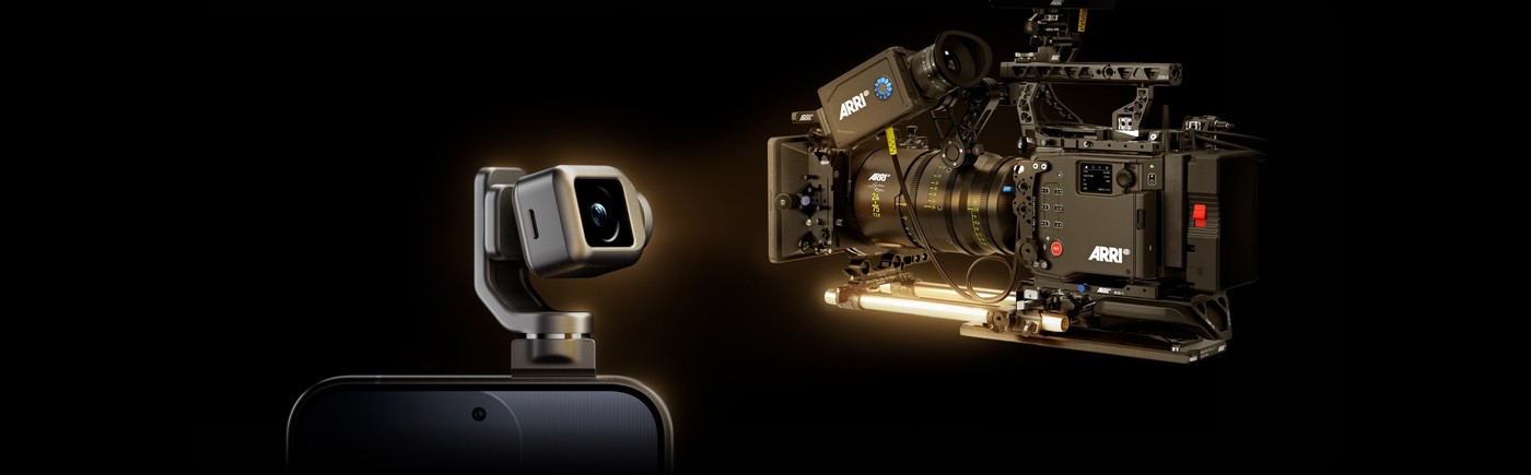 Honor Robot Phone with its gimbal arm deployed, positioned beside a rigged ARRI cinema camera