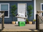 Uber Zipline Drone Delivery Aims at 1 Million a Day Zipline drone lowering an Uber Eats bag toward a front porch