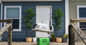 Zipline drone lowering an Uber Eats bag toward a front porch