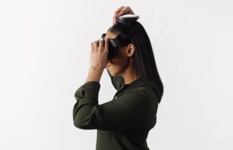 Person wearing the Steam Frame VR headset in Valve's fit and comfort guide