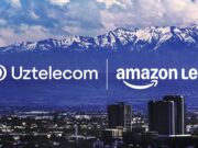 Amazon Leo and Uztelecom logos over a Tashkent skyline with snow-capped mountains behind
