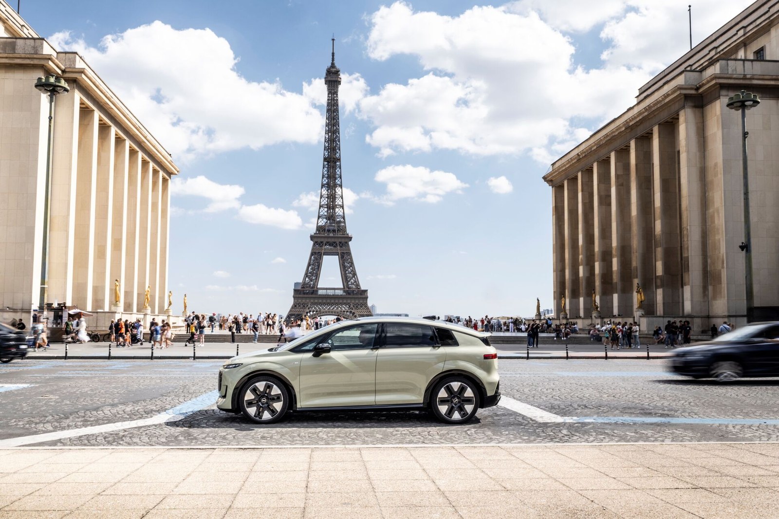Audi A2 e-tron in Pistachio green parked side-on in front of the Eiffel Tower at its Paris reveal