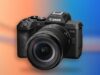 Canon EOS R8 Mark II with RF24-105mm F4-7.1 IS STM lens on a coral and cobalt background