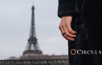 Circular Ring 2 Adds Blood Pressure Checks in 60 Seconds Circular Ring 2 worn on a hand with the Eiffel Tower in the background