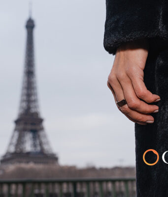 Circular Ring 2 Adds Blood Pressure Checks in 60 Seconds Circular Ring 2 worn on a hand with the Eiffel Tower in the background
