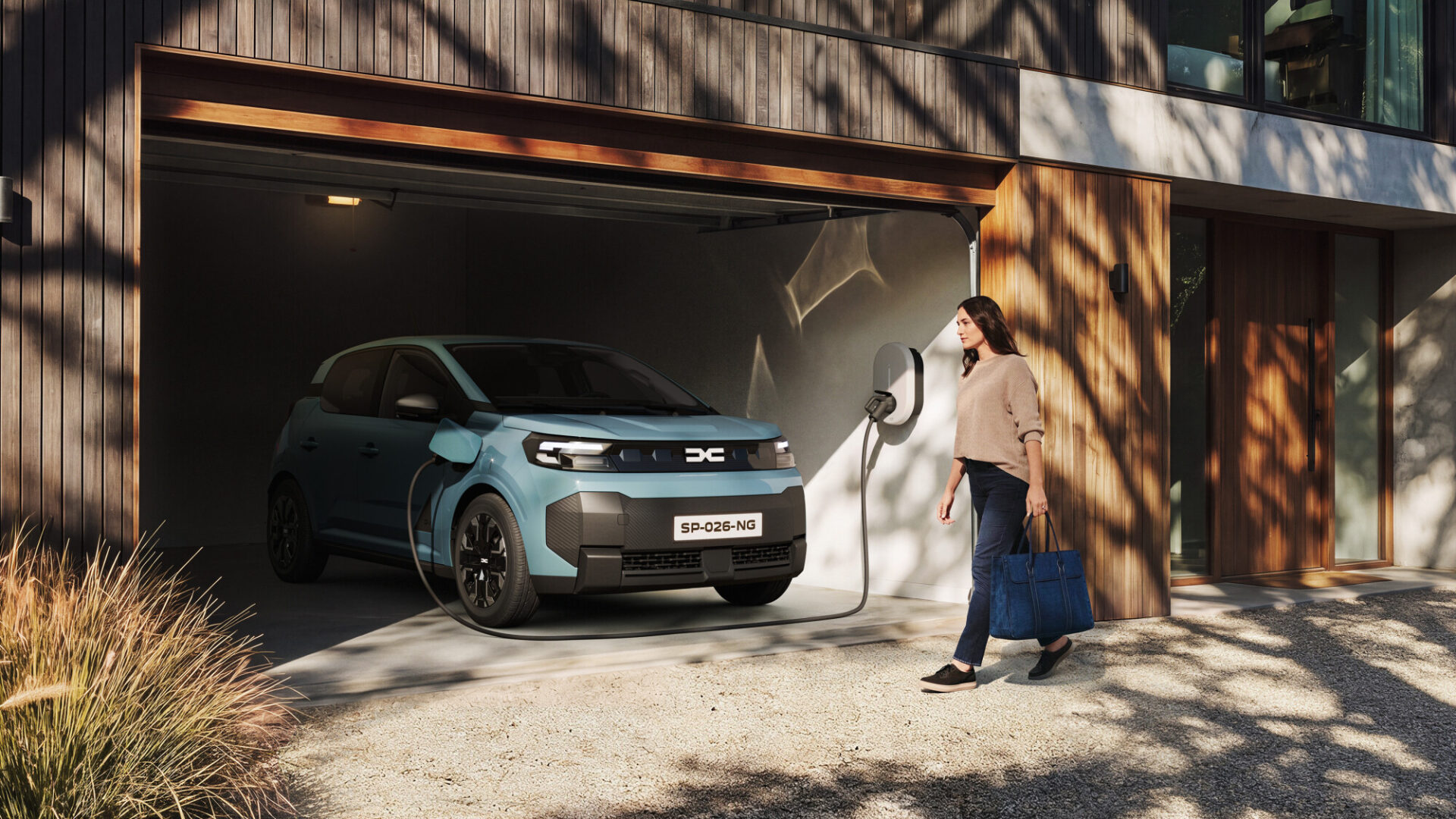 Dacia Spring EV connected to a home wall charger