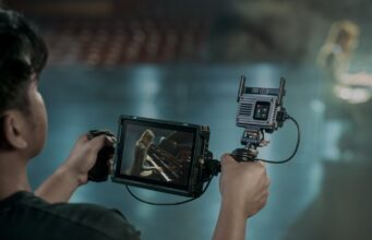 DJI SDR Transmission 2 Brings 4K HDR to Wireless Monitoring DJI SDR Transmission 2 receiver mounted beside a handheld production monitor