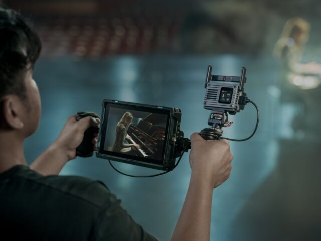 dji-sdr-transmission-2-official-inline DJI SDR Transmission 2 receiver mounted beside a handheld production monitor