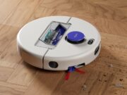 Dyson Nurovi R1 Dry robot vacuum collecting debris on a wood floor