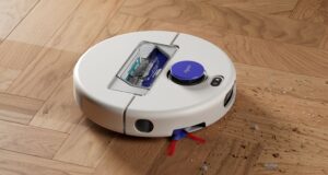 Dyson Nurovi R1 Dry robot vacuum collecting debris on a wood floor