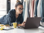 Acer Vero 16 Laptop Pairs Tool-Free Repairability With Core Ultra X9 and 3K OLED Acer Vero 16 laptop open on a white table while its owner works in a bright studio.