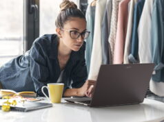 Acer Vero 16 Laptop Pairs Tool-Free Repairability With Core Ultra X9 and 3K OLED Acer Vero 16 laptop open on a white table while its owner works in a bright studio.