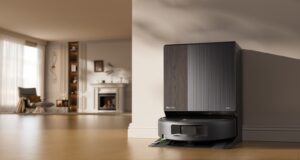 Roomba Max 875 Combo docked at its AutoWash Dock in a bright living room.
