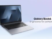 Open gray Galaxy Book6 on a light blue backdrop, screen and keyboard facing the camera