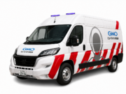 GMO humanoid ambulance maintenance van with red stripes and purple roof lights