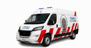GMO humanoid ambulance maintenance van with red stripes and purple roof lights