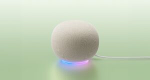 Google Home MCP Opens Early Access White Google Home Speaker on a mint backdrop with a blue-to-purple light ring and power cable