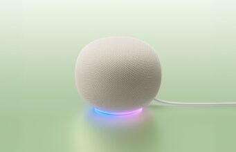 Google Home MCP Opens Early Access White Google Home Speaker on a mint backdrop with a blue-to-purple light ring and power cable