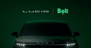 Lucid and Bolt logos above the front of a dark Lucid SUV on a deep green background