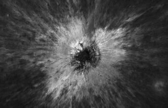 McGetchin Crater: NASA’s Moon Orbiter Finds a Once-in-a-Century Impact Overhead black-and-white Lunar Reconnaissance Orbiter view of McGetchin crater, a dark pit surrounded by a bright starburst of ejected debris