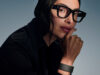 Woman wearing Meta Ray-Ban Display glasses and Neural Band