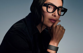Meta hologram Hits Ray-Ban Display This Fall Woman wearing Meta Ray-Ban Display glasses and Neural Band