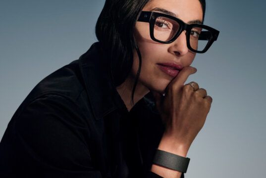 Woman wearing Meta Ray-Ban Display glasses and Neural Band