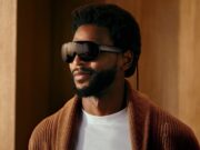 A man wearing Meta VR Glasses, which look like oversized black sunglasses