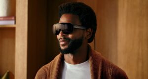 A man wearing Meta VR Glasses, which look like oversized black sunglasses