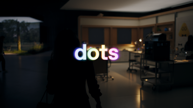 OpenAI dots launch-film poster showing illuminated dots lettering in a dim office