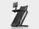 Peloton Tread Flex Starts at $2,195 Peloton Tread Flex folded upright on a pale studio floor with a swivel screen showing a strength class