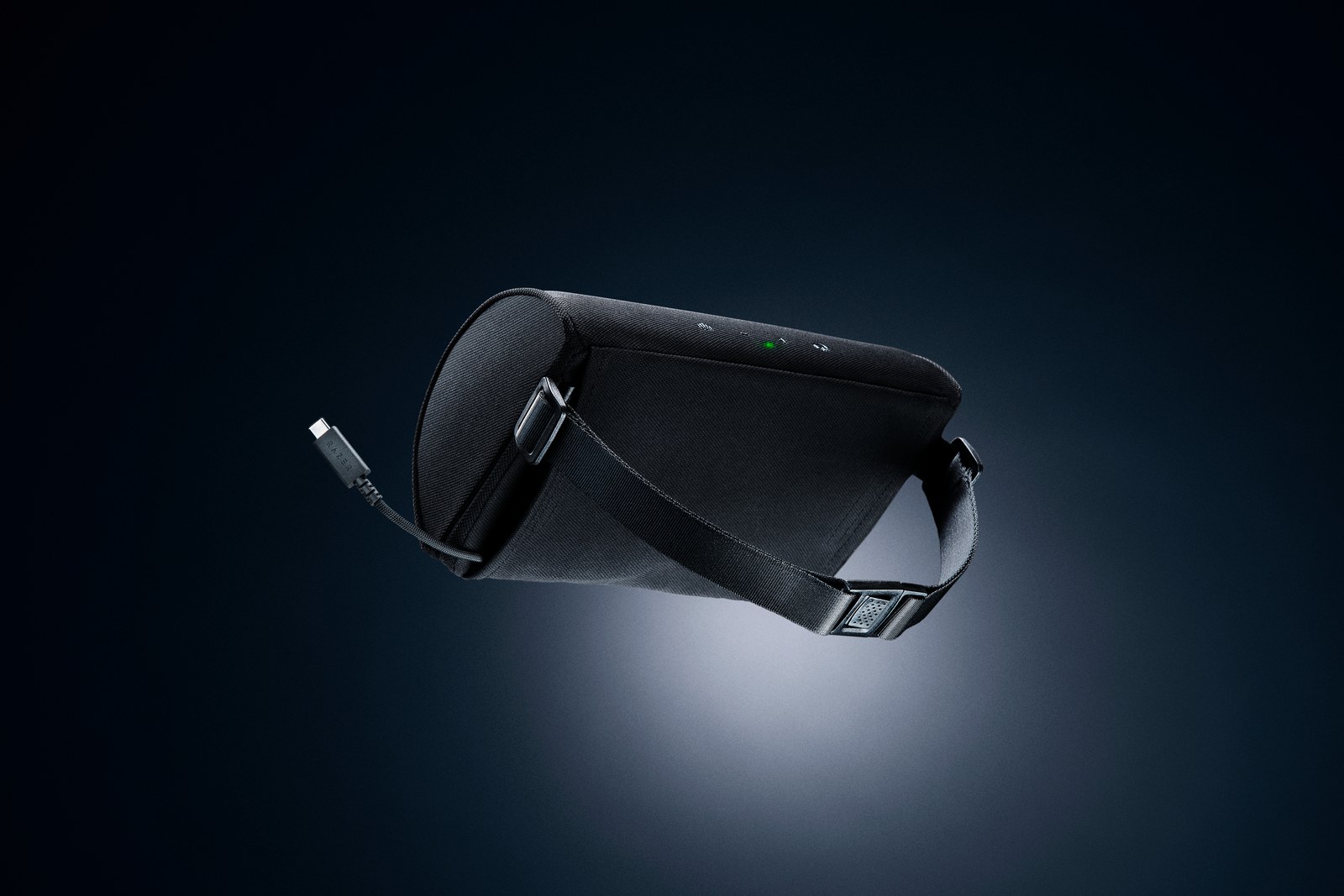 Razer Clio X speaker head cushion floating on a dark background with its built-in USB-C cable extended